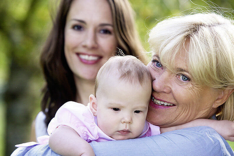 Close up portrait of a three female generations