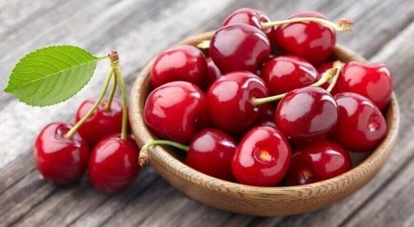Cherry on a wooden background