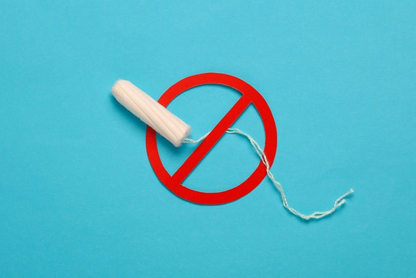 Tampon with prohibition sign on blue background