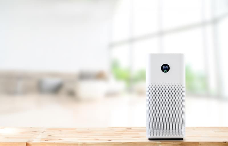 air purifier a living room, air cleaner removing fine dust in house. protect PM 2.5 dust and air pollution concept