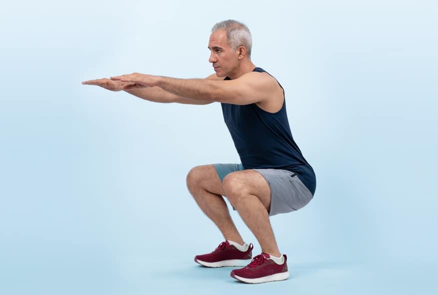 Active and fit physique senior man warming up before exercise. Clout